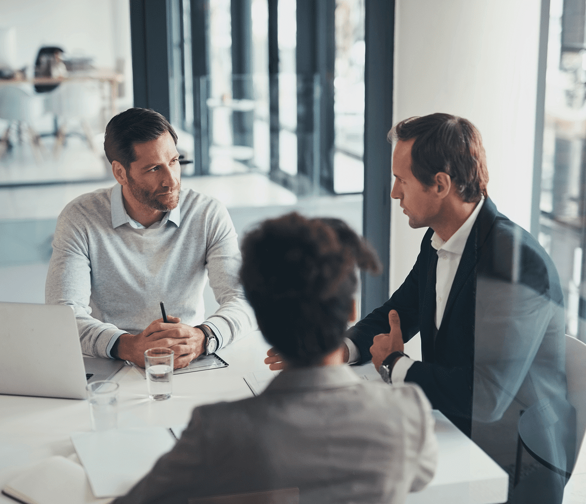 Three people having a business meeting.