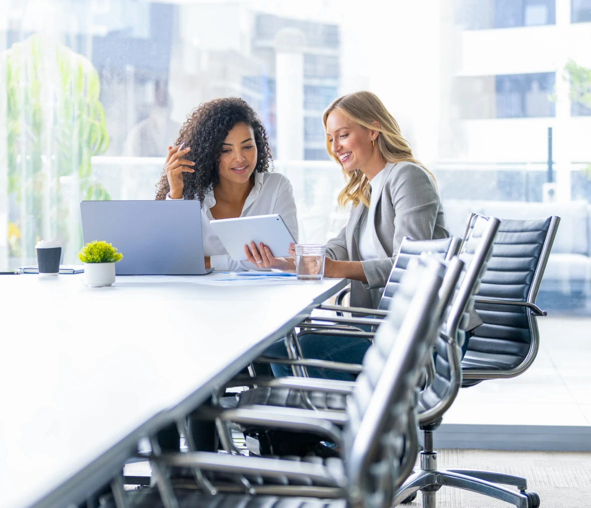 Two women collaborating in modern office