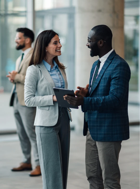 Business professionals discussing with a tablet
